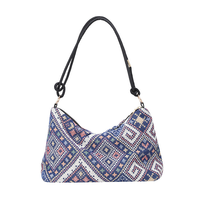 Gepunktete Schultertasche
