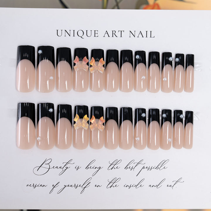 Dekorative Press-On Nagelkunst mit eleganten Schleifenakzenten