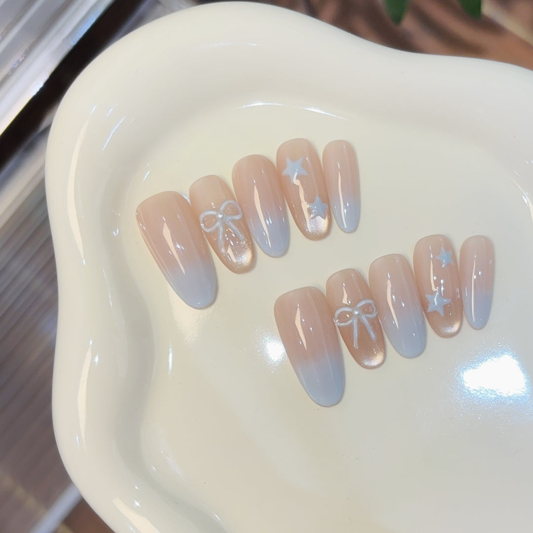 Elegante Kunstnagelset mit Schleifen- und Sternendesigns Karnz