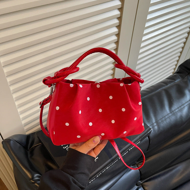 Verspielt gepunktete Handtasche