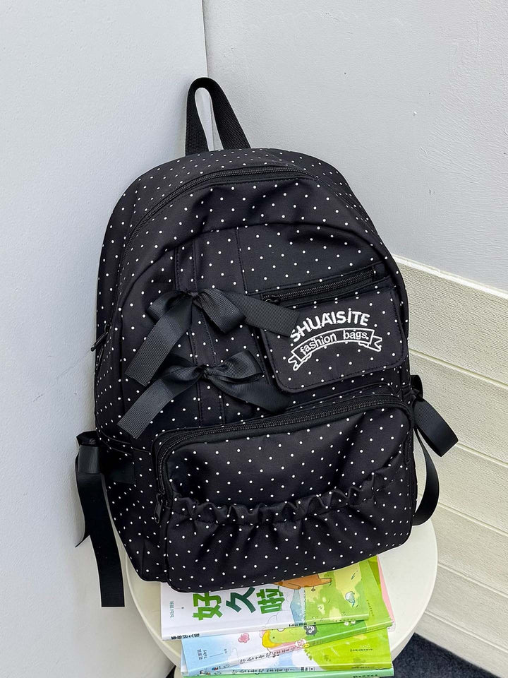 Verspielt gepunkteter Rucksack