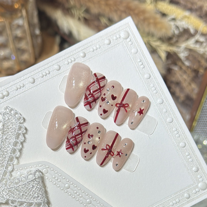 Romantisches Theme Press-On Nail Set mit Herz- und Schleifenakzenten Karnz