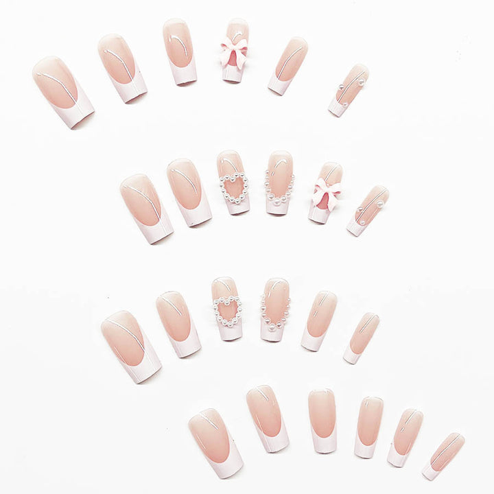 Kunstnagelset mit eleganten 3D-Blüten und Perlverzierungen Karnz