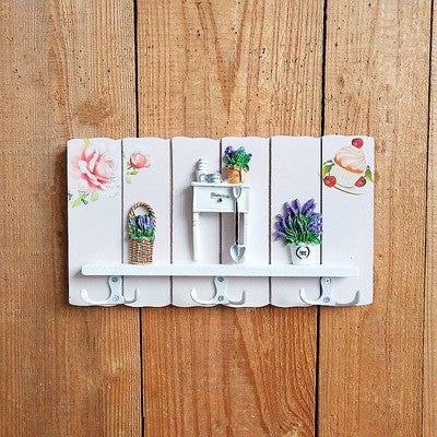 Dekorativer floral Wandhakenregal