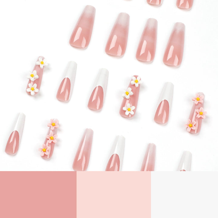 Kunstvolle Nagelverlängerungen mit elegantem Farbverlauf und kreativen Blumenakzenten Karnz