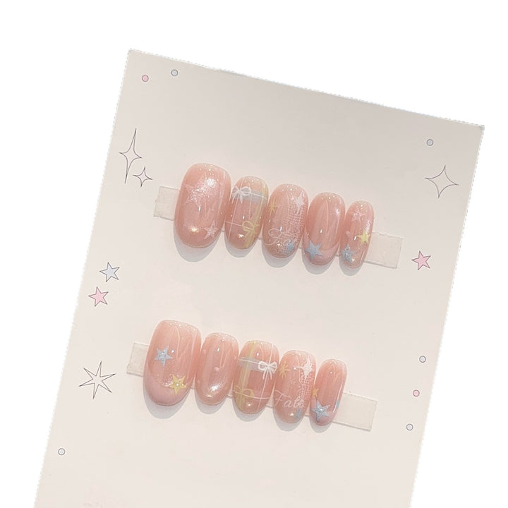 Kunstnägel mit Romantischen Sternen- und Glitzermotiven Karnz