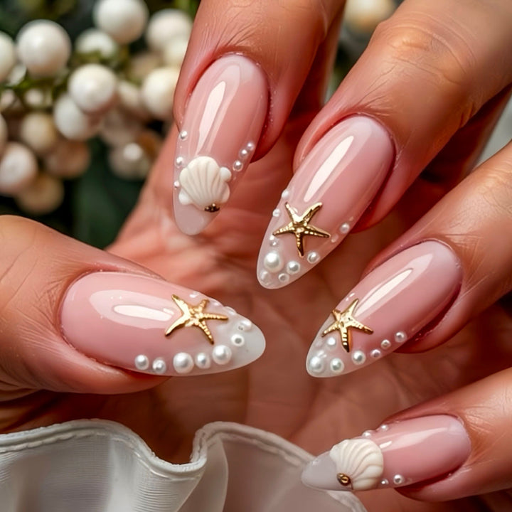 Künstlerische von Muscheln inspirierte Press-On Nagelkunst Karnz