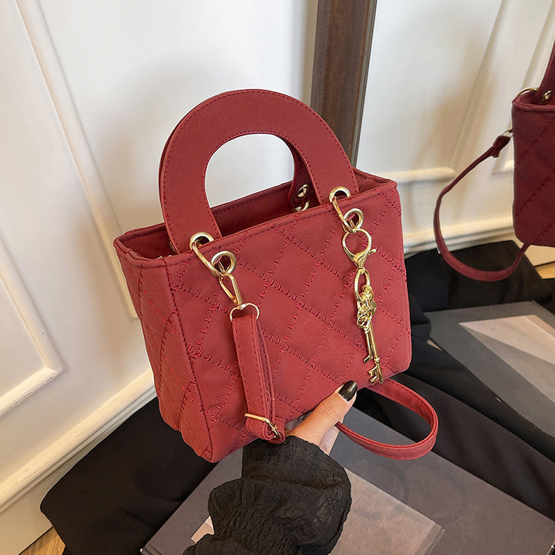 Luxuriöse Metallic Stepphandtasche