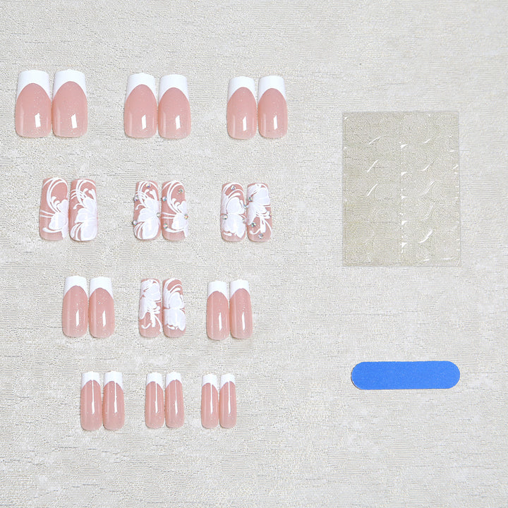Kunstnagelset mit filigraner Blüten- und Glitzerverzierung Karnz