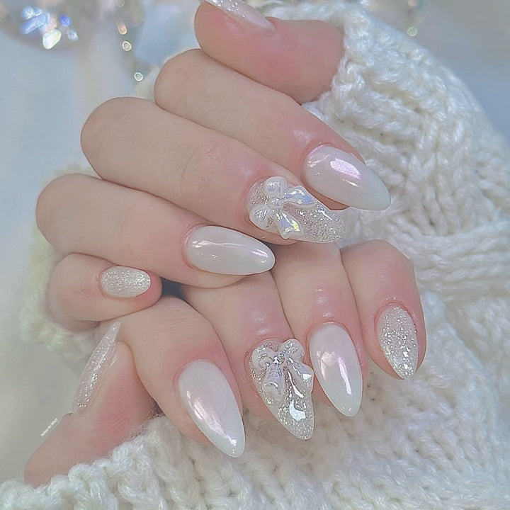 Elegante Stiletto-Nagelkunstverlängerungen mit 3D-Schleifenakzenten Karnz