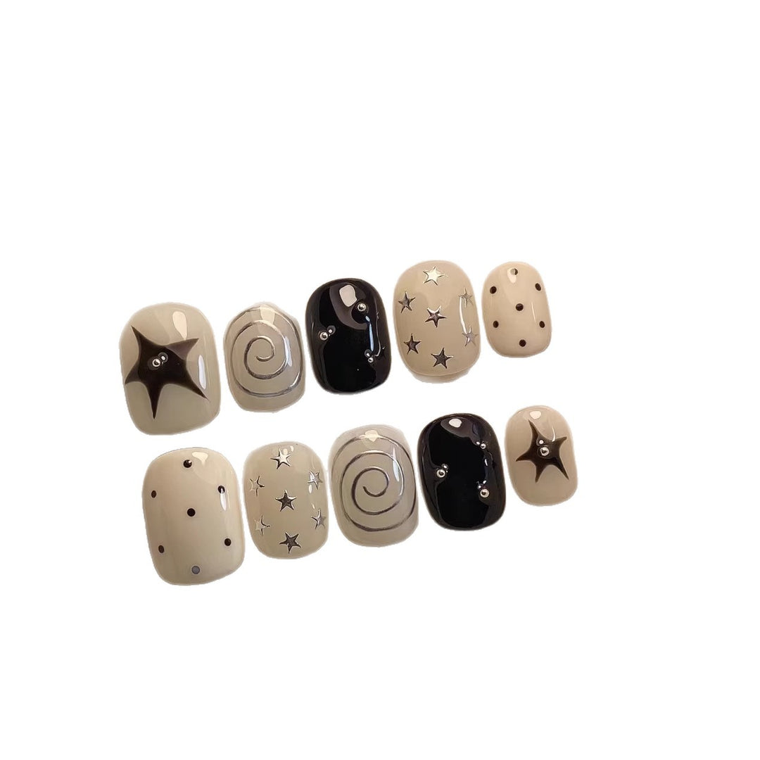 Künstlerisches Press-On Nagelset mit Stern- und Wirbel-Designs