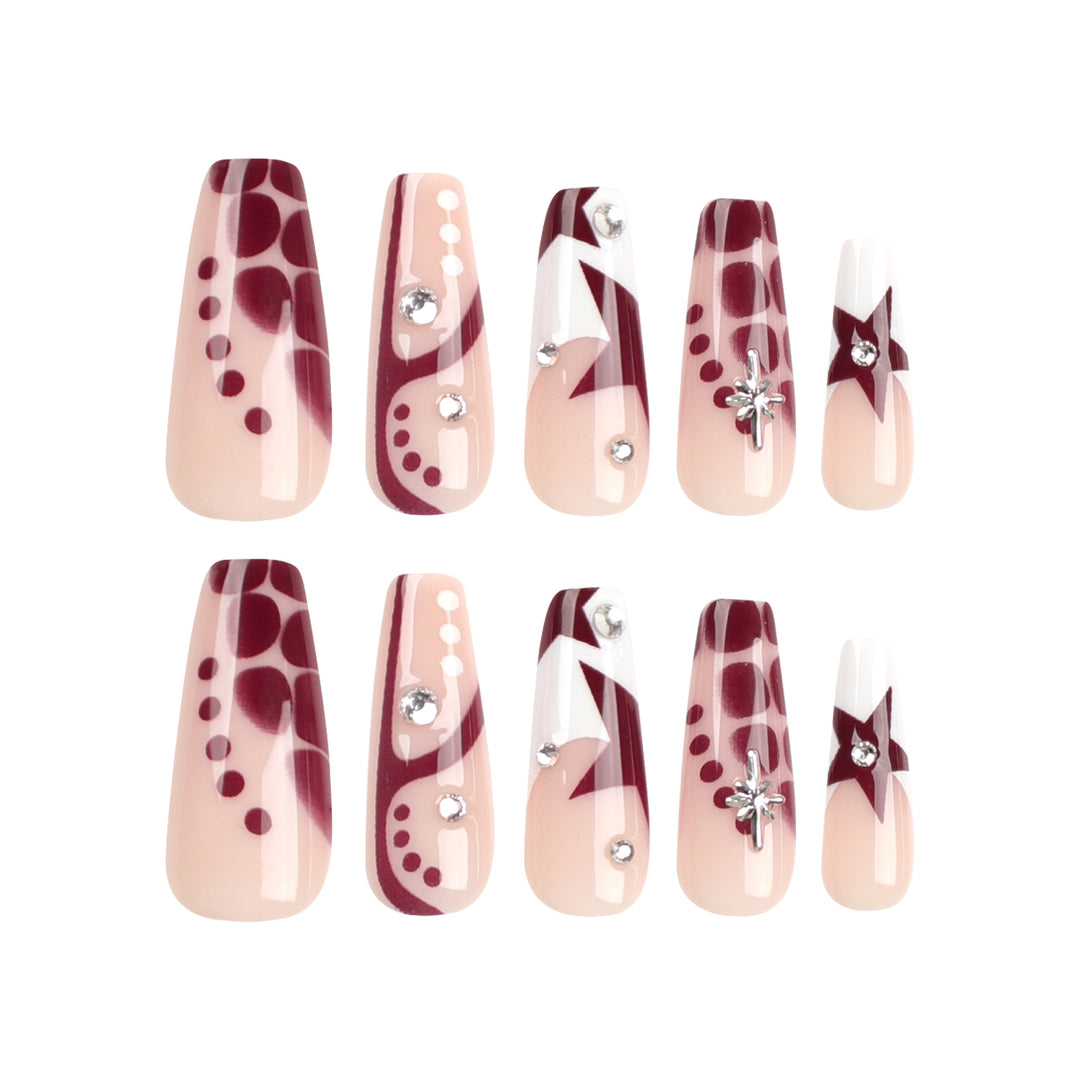 Kunstvolle Nagelverlängerungen mit Glitzer und Sternenmotiven Karnz