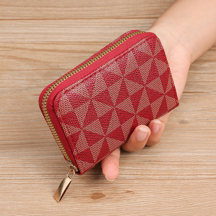 Geometrisch gemusterte Reißverschluss-Münztasche Karnz