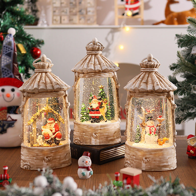 Beleuchtete Weihnachtslaterne mit Schneeszenen Karnz