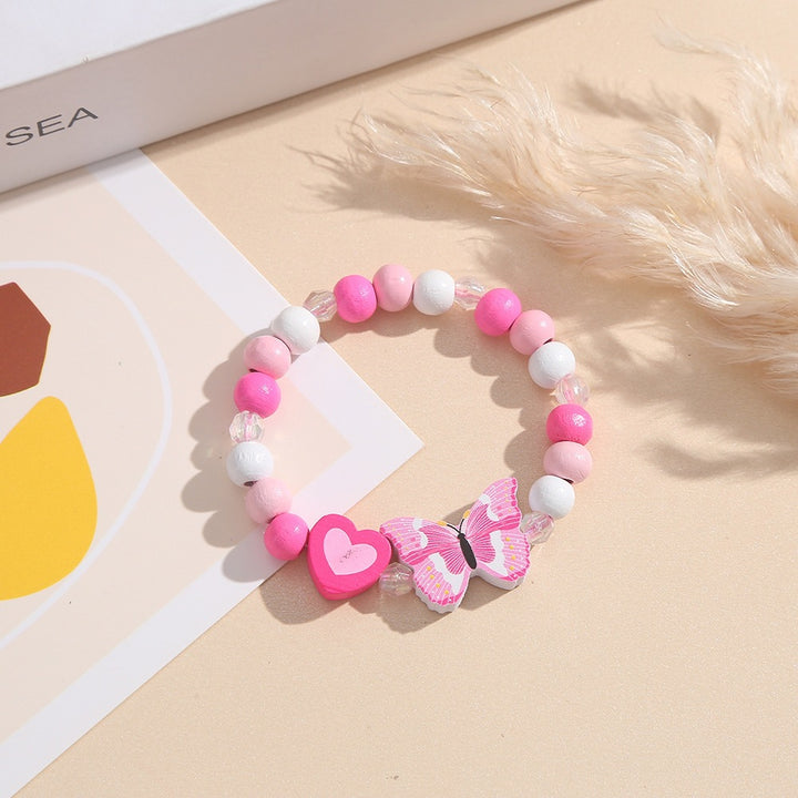 Verspieltes Armband mit Herz- und Schmetterlings-Anhängern Karnz