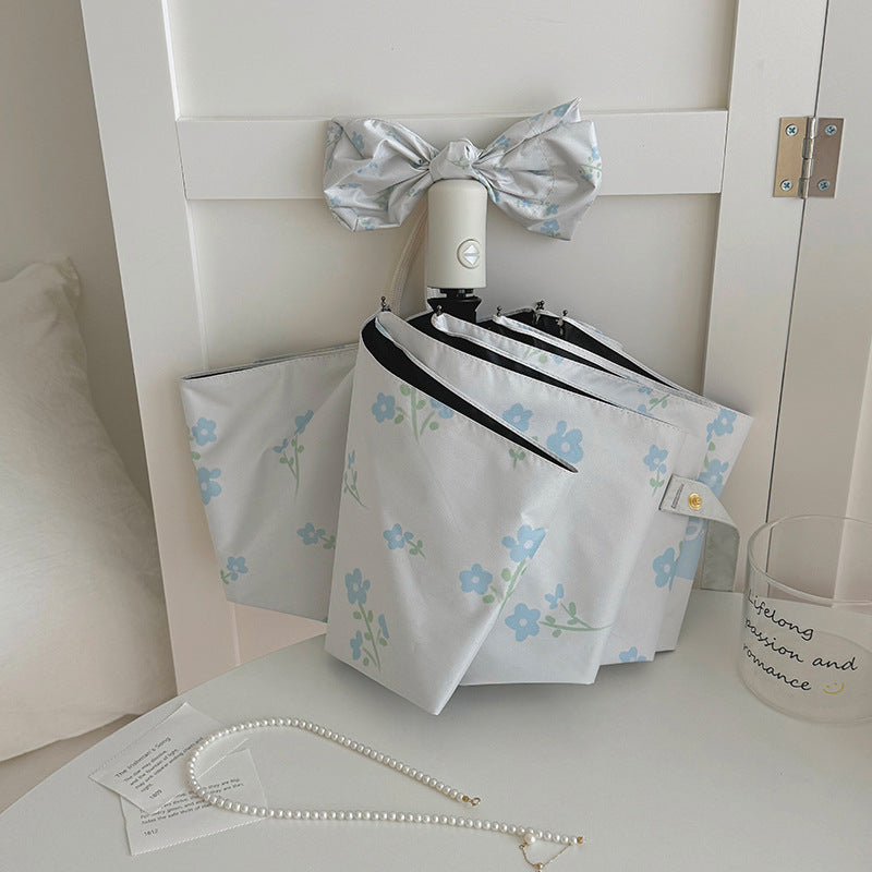 Damen Faltender Regenschirm mit stilvollem Blumendesign Karnz