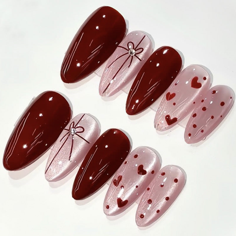 Dekoratives Press-On Nagelset mit Herz- und Schleifendesigns Karnz