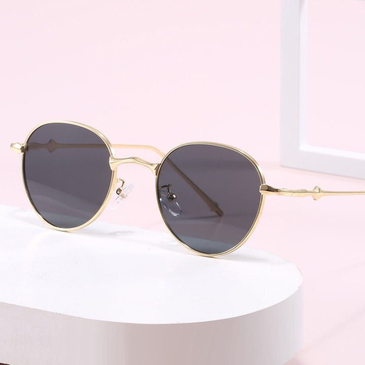 Damen elegante runde Sonnenbrille mit modischem Metallrahmen Karnz
