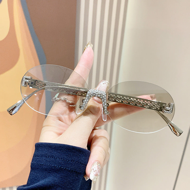 Damen Sonnenbrille mit glitzerndem Rahmen und ovalen Gläsern Karnz