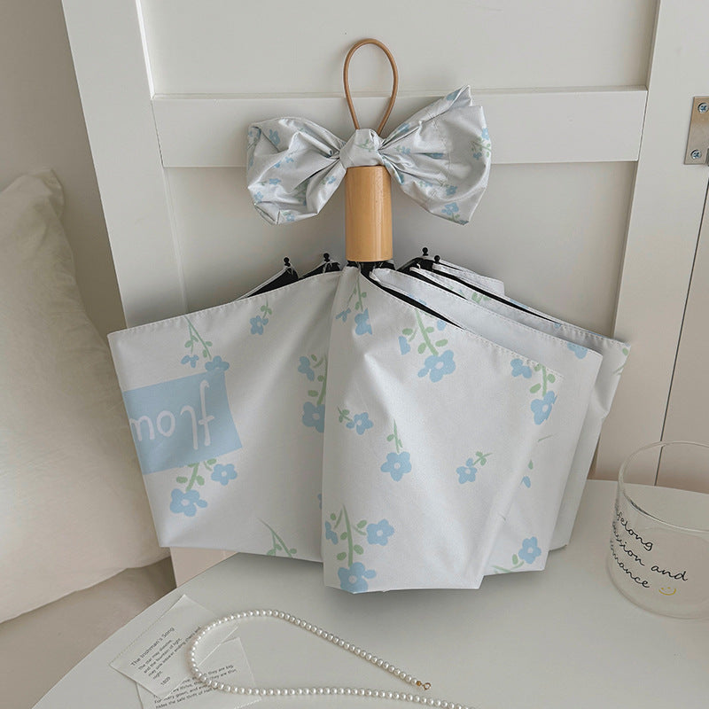 Damen Faltender Regenschirm mit stilvollem Blumendesign Karnz