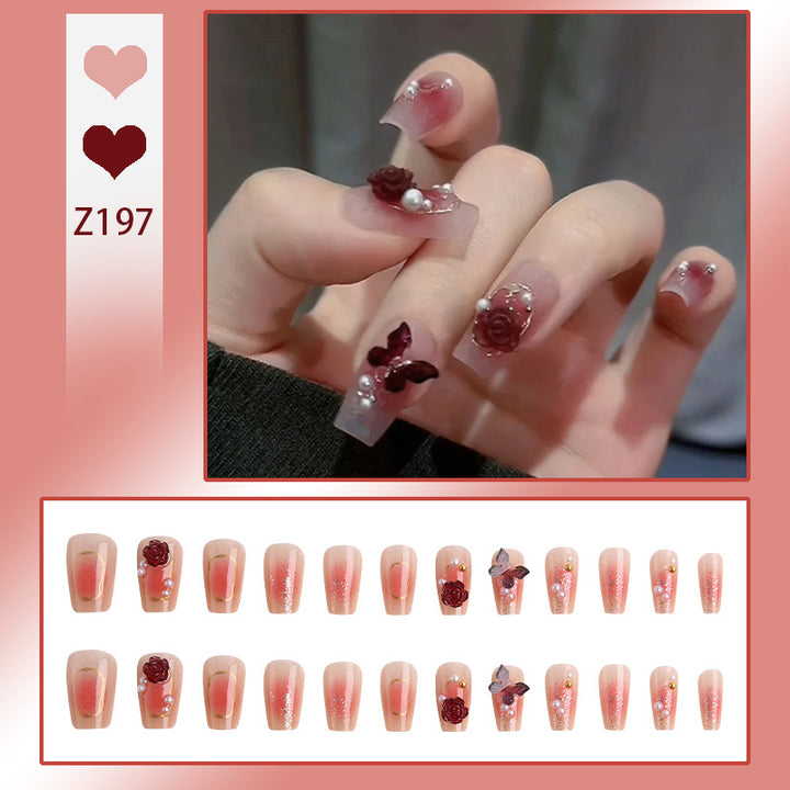 Kunstnagelset mit eleganten 3D-Blüten- und Schmetterlingsverzierungen Karnz