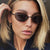Damen elegante runde Sonnenbrille mit modischem Metallrahmen Karnz