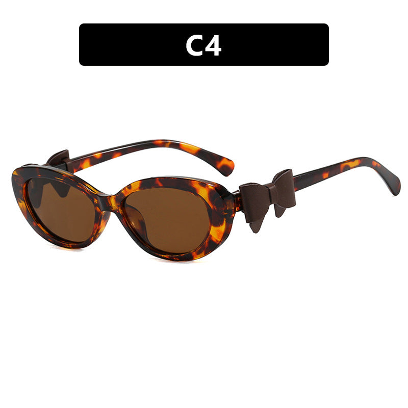 Damen modische Sonnenbrille mit verspieltem Schleifen-Design Karnz