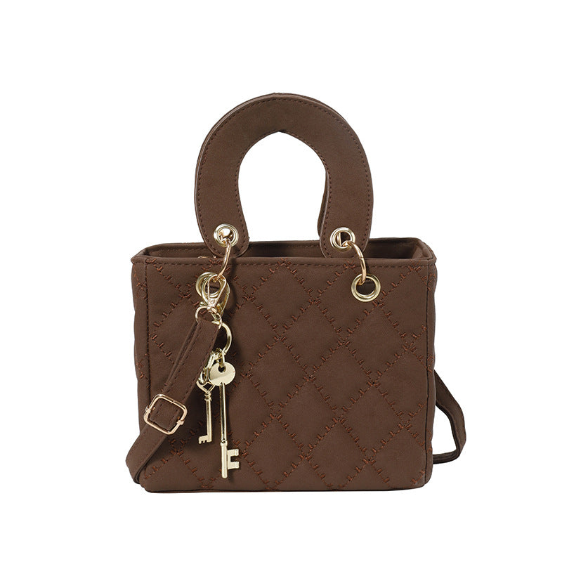 Luxuriöse Metallic Stepphandtasche