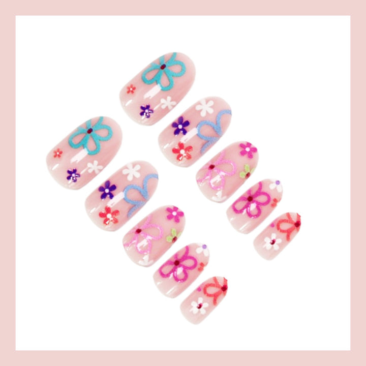 Kunstnagelset mit bunten Blumenmotiven Karnz