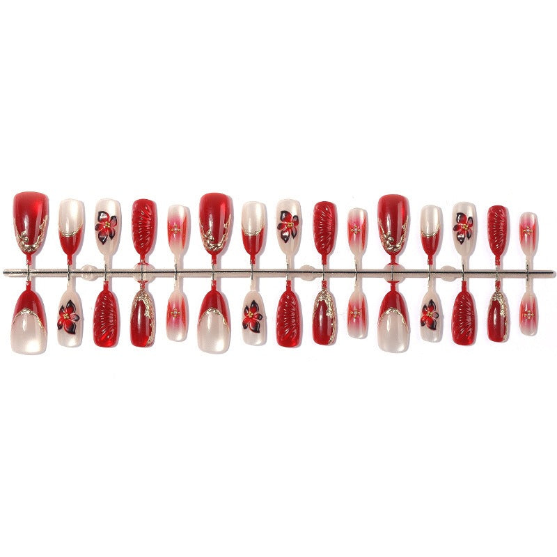 Kunstnagelset mit floralem Design und eleganten Glitzerdetails Karnz