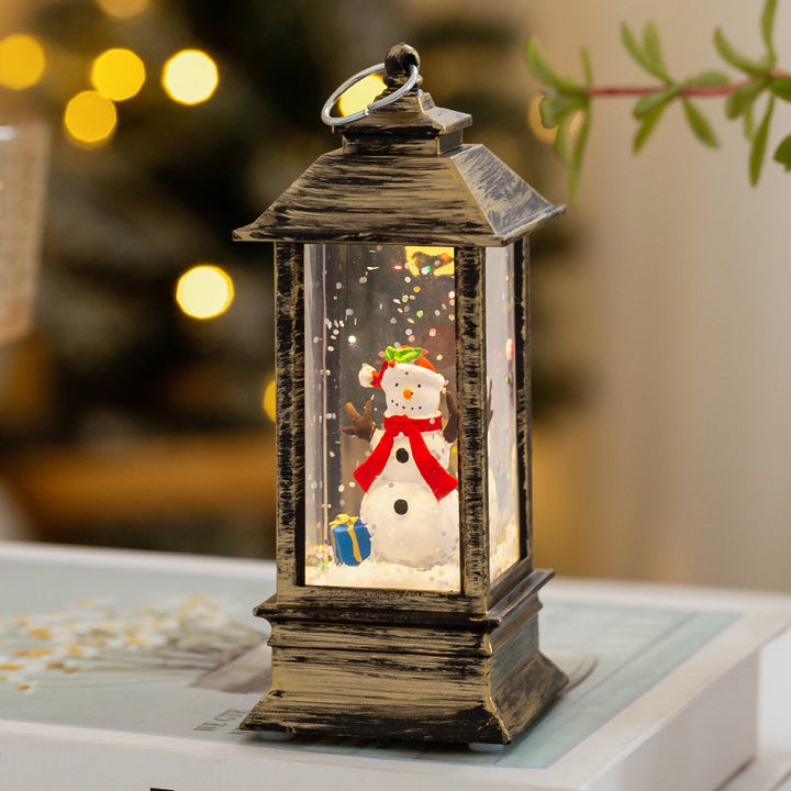 Weihnachtslaterne mit LED-Beleuchtung und dekorativem Schneeeffekt