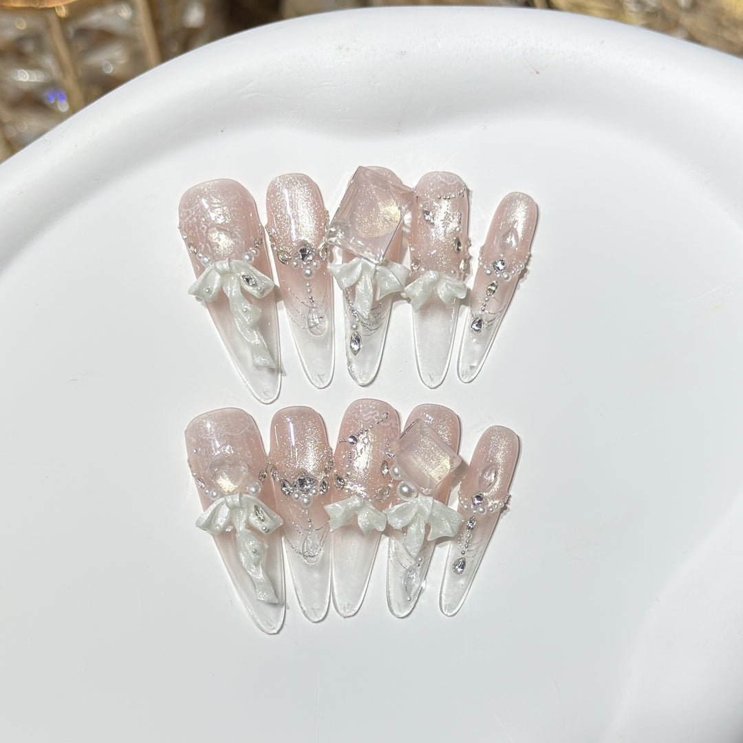 Elegantes Press-On-Acryl-Nagelset mit dekorativem Bogen und Glitzerakzenten Karnz