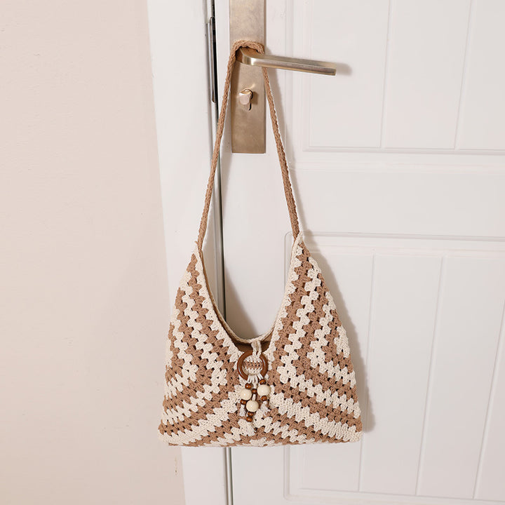 Damen Handtasche mit kunstvollem Flechtmuster Karnz