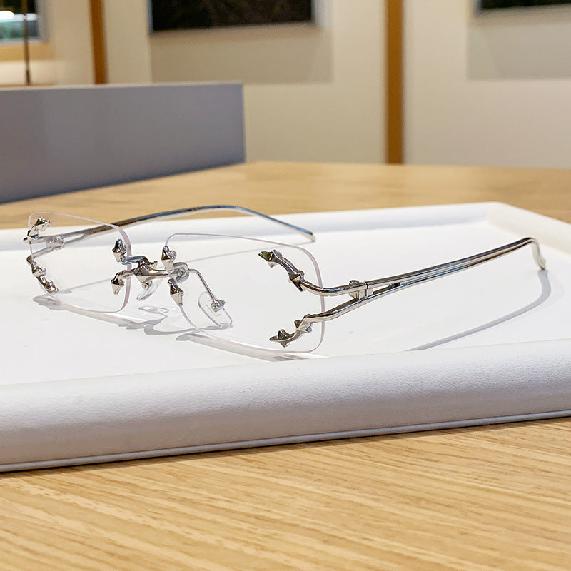 Damen modische Sonnenbrille mit filigranem Metallrahmen und transparenten Gläsern Karnz