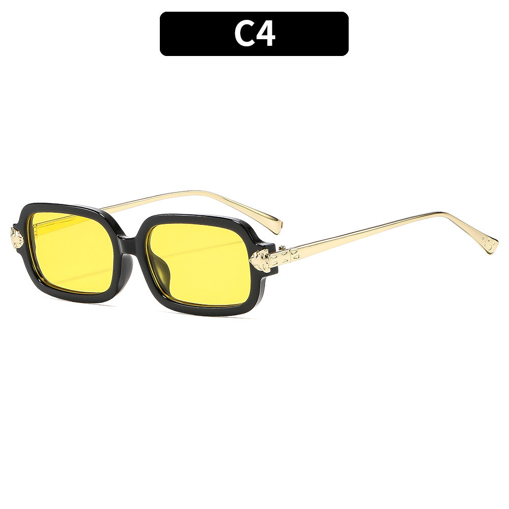 Hochwertige winkelige Sonnenbrille mit goldenen Akzenten