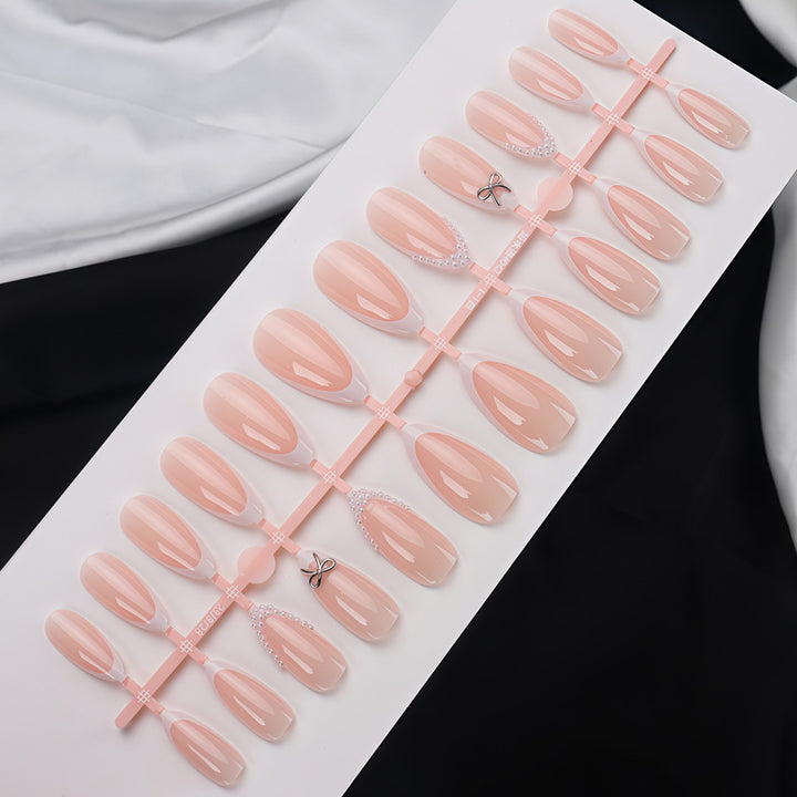 Elegantes Acryl Press-On Nagelset mit Perle und Schleifenakzenten Karnz
