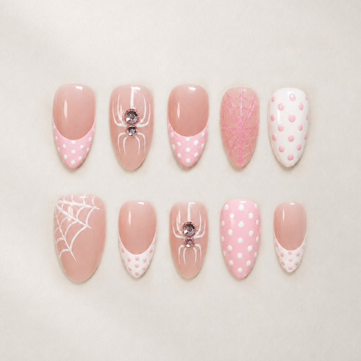 Kunstnagelset mit verspielten Spinnen- und Punkte-Motiven Karnz