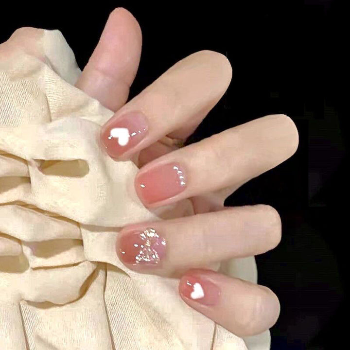 Kreatives Kunstnagelset mit Glitzer- und eleganten Muster Akzenten Karnz