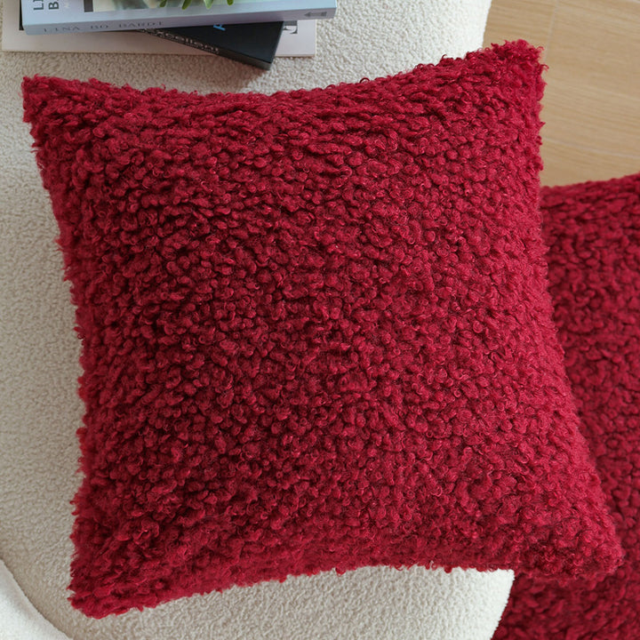 Rechteckiges Dekokissen mit Bouclé-Relief und Quasten Karnz