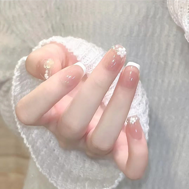 Kunstnagelset mit eleganten Blumenapplikationen und exquisite Glitzerverzierungen Karnz