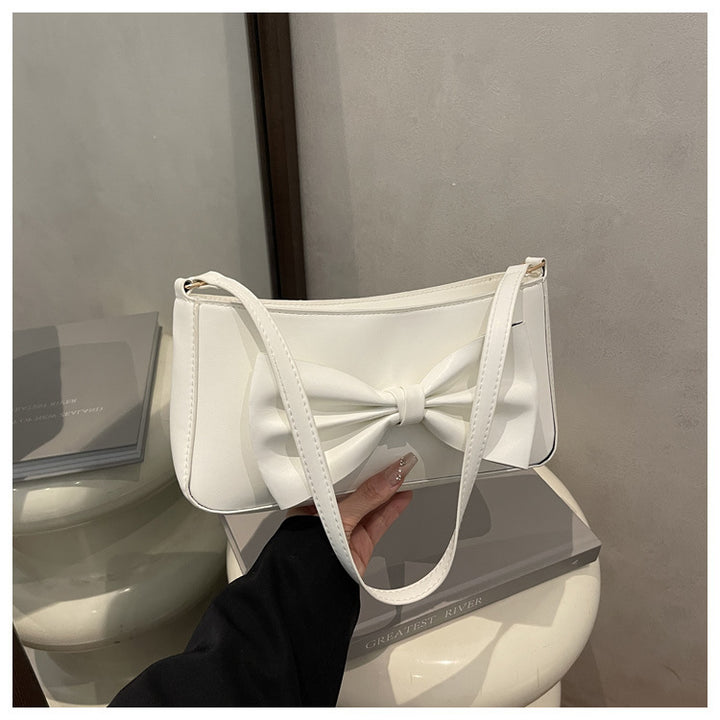 Elegante Clutch mit Schleifen-Detail für den Abend