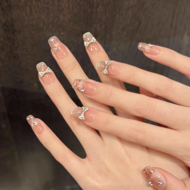 Dekoratives Strass-Bow Press-On Nagelset Karnz
