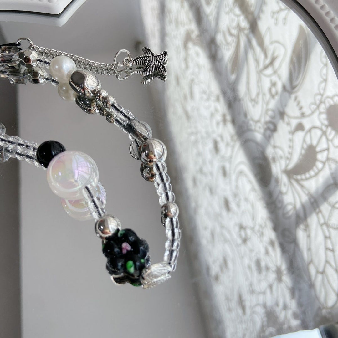 Eleganter Perlen-Charm-Brillenhalter Karnz