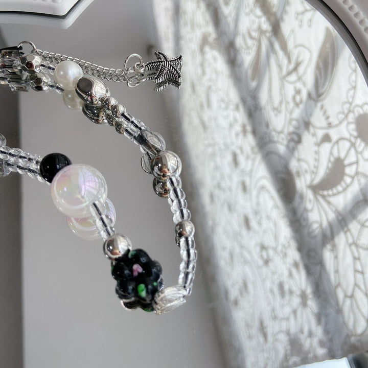 Eleganter Perlen-Charm-Brillenhalter Karnz