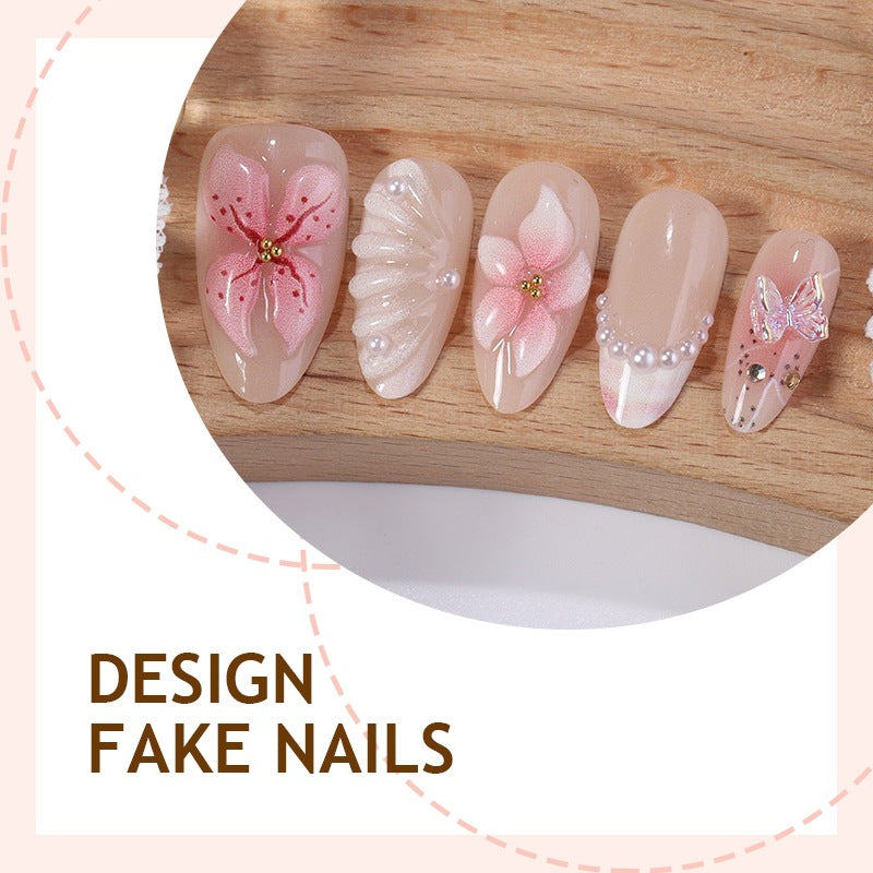 Kreatives Kunstnagelset mit filigranen Blüten- und Glitzerverzierungen Karnz