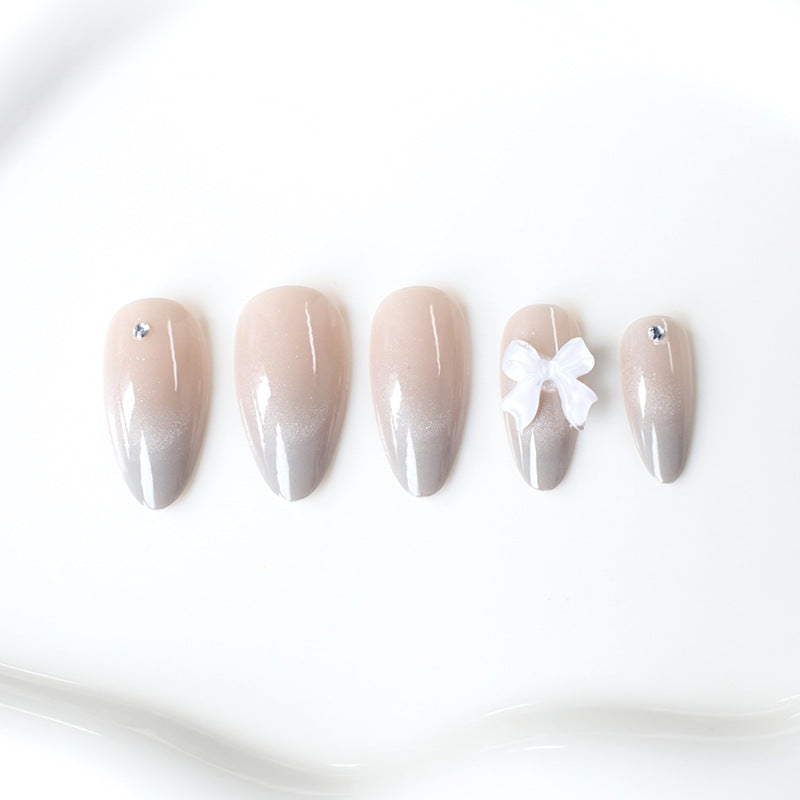 Elegante Strass- und Schleifen-Nagelkunstverlängerungen Karnz