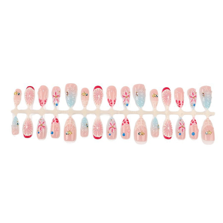 Kunstnagelset mit maritimen Motiven und luxuriösen Glitzerakzenten Karnz