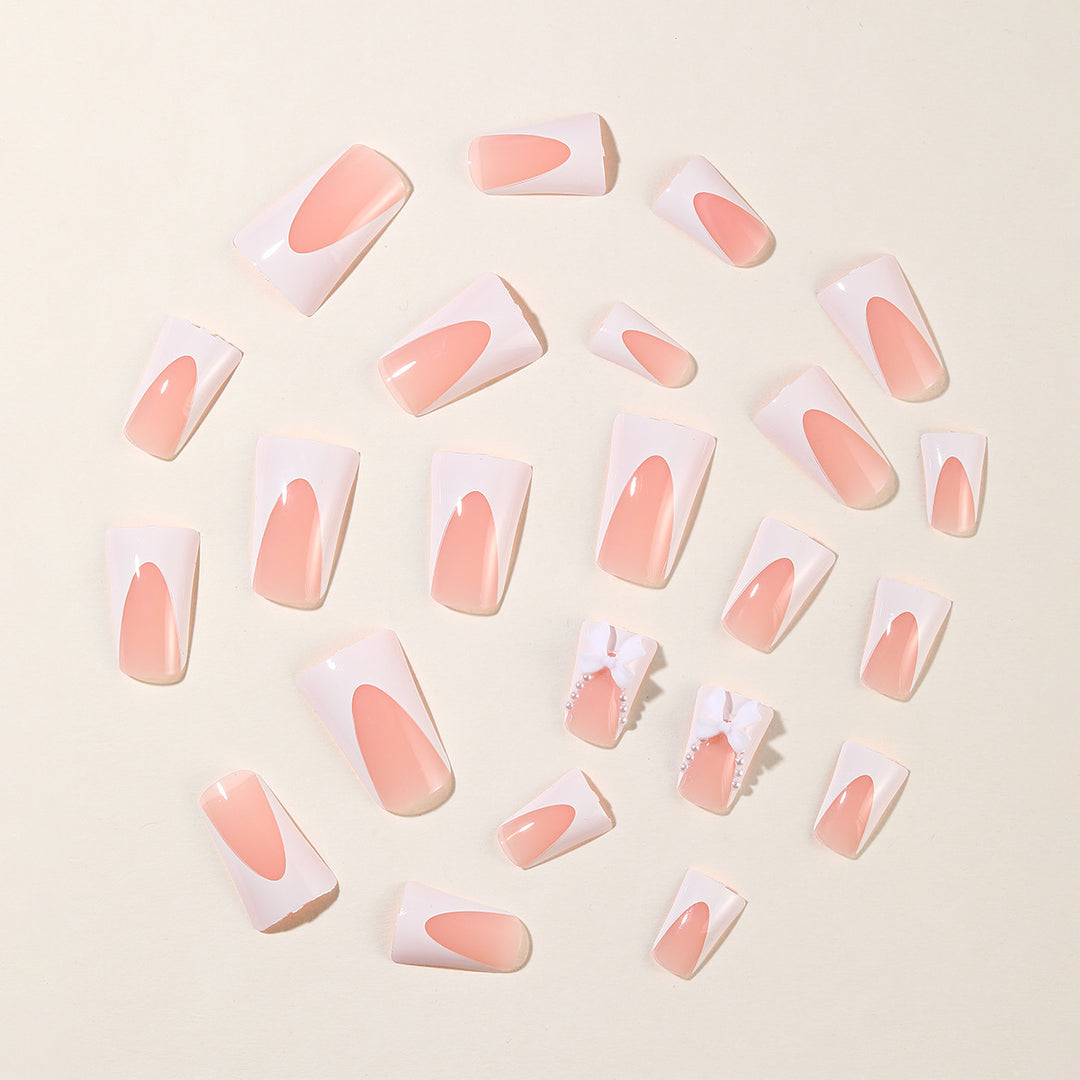 Elegante Stiletto-Nagelkunstverlängerungen mit Schleifenakzenten Karnz