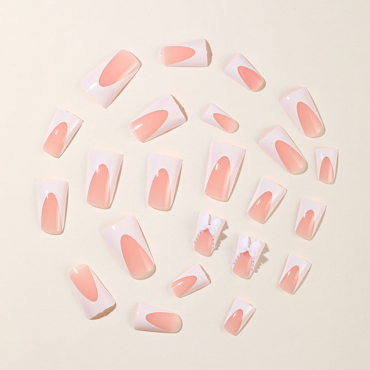 Elegante Stiletto-Nagelkunstverlängerungen mit Schleifenakzenten Karnz