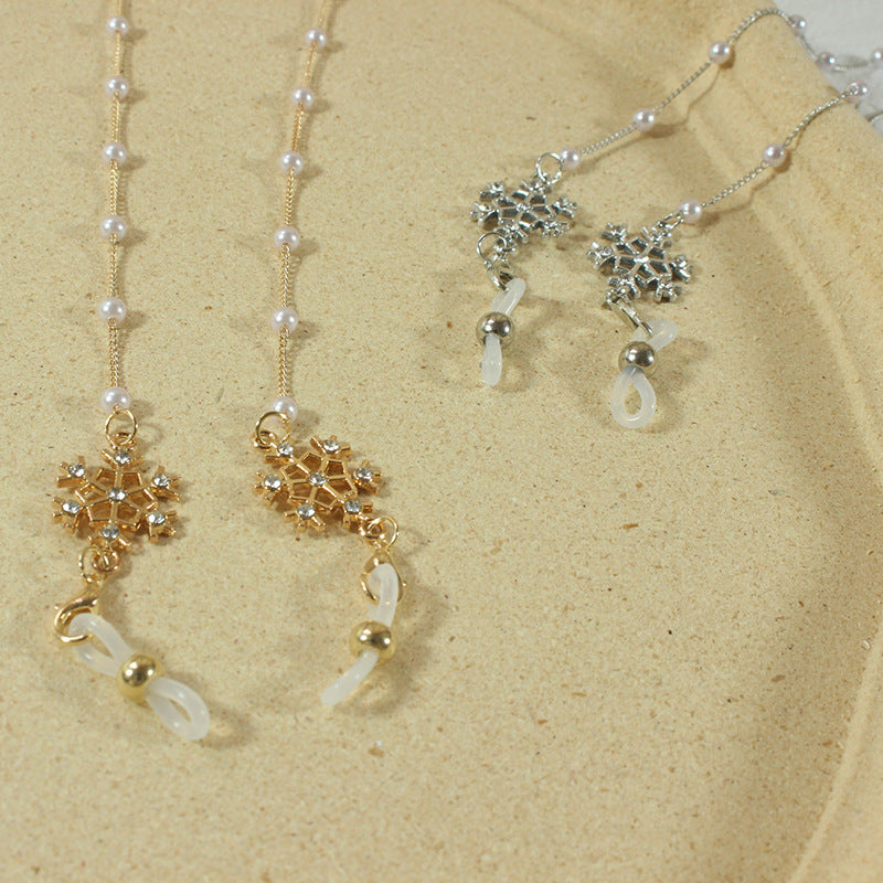 Elegante Brillenhalterkette mit Perlen und Schneeflockenanhänger Karnz